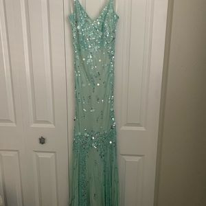 Beautiful boutique and one of a kind, teal sequined, slight mermaid bodice dress